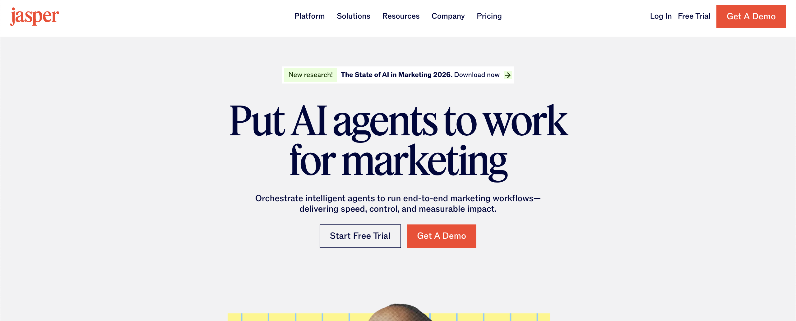 Jasper's landing page, showcasing the platform's motto: put AI agents to work for marketing, and calling the user to start a free trial or get a demo